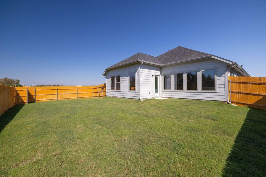 Exterior details and patio area of a home in Trinity Ranch, Elgin (Image 18).