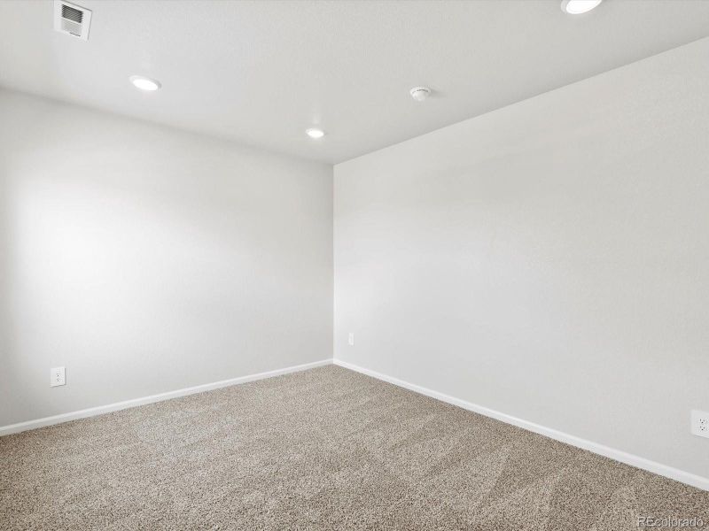 Spacious, unfurnished interior of a new home in Ridgeline Vista: The Canyon Collection, Brighton (Image 17).