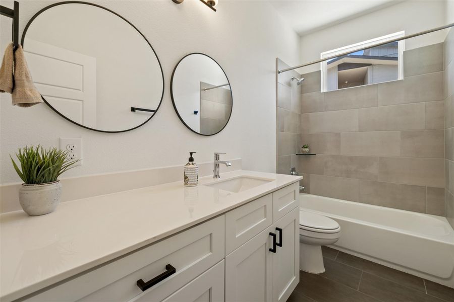 Full bath featuring vanity and tub / shower combination Full bath featuring vanity and tub / shower combination