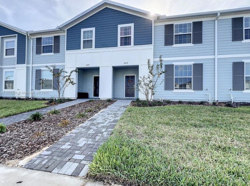 Front exterior of a new home in , Davenport, FL, highlighting curb appeal (Image 18).