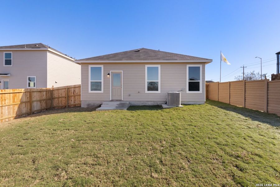 Exterior details and patio area of a home in Woodside Farms, Seguin (Image 19).