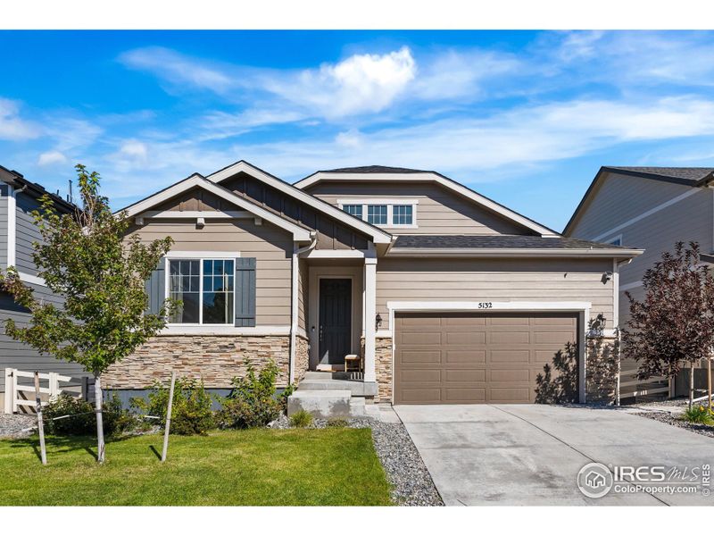 Front exterior of a new home in , Castle Rock, CO, highlighting curb appeal (Image 1).
