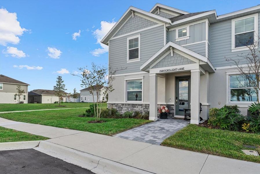 Front exterior of a new home in , Sarasota, FL, highlighting curb appeal (Image 24).