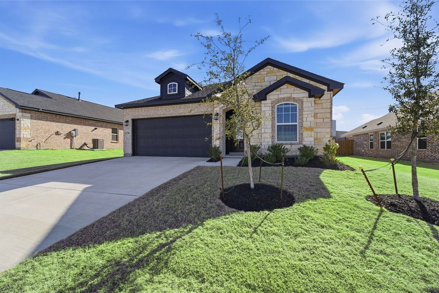 Front exterior of a new home in Pebblebrook, Sherman, TX, highlighting curb appeal (Image 25).
