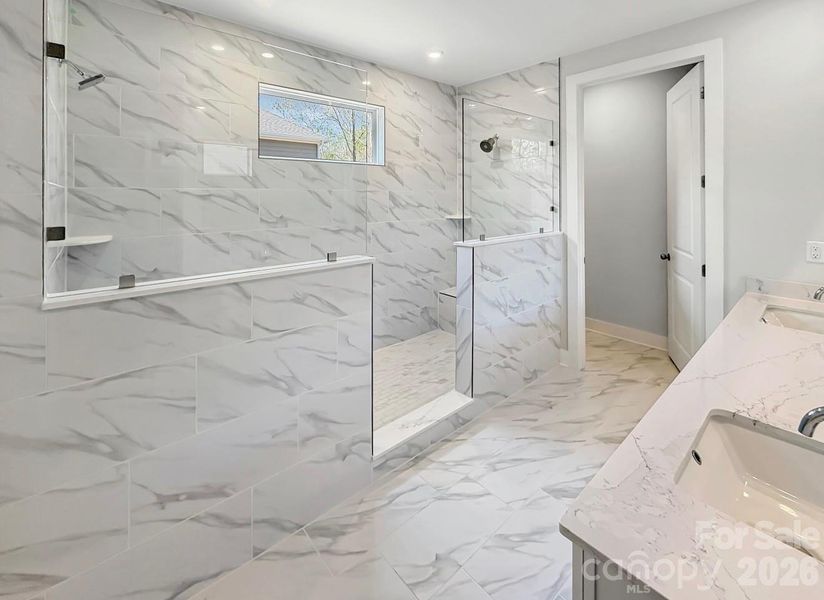 Large walk in shower with dual rain heads
