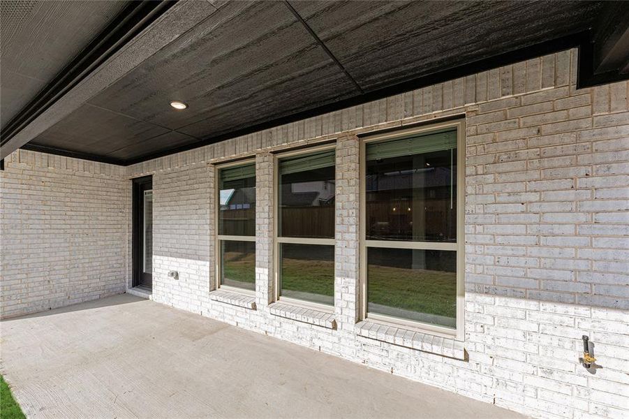 Exterior details and patio area of a home in Creekview Meadows, Pilot Point (Image 27).