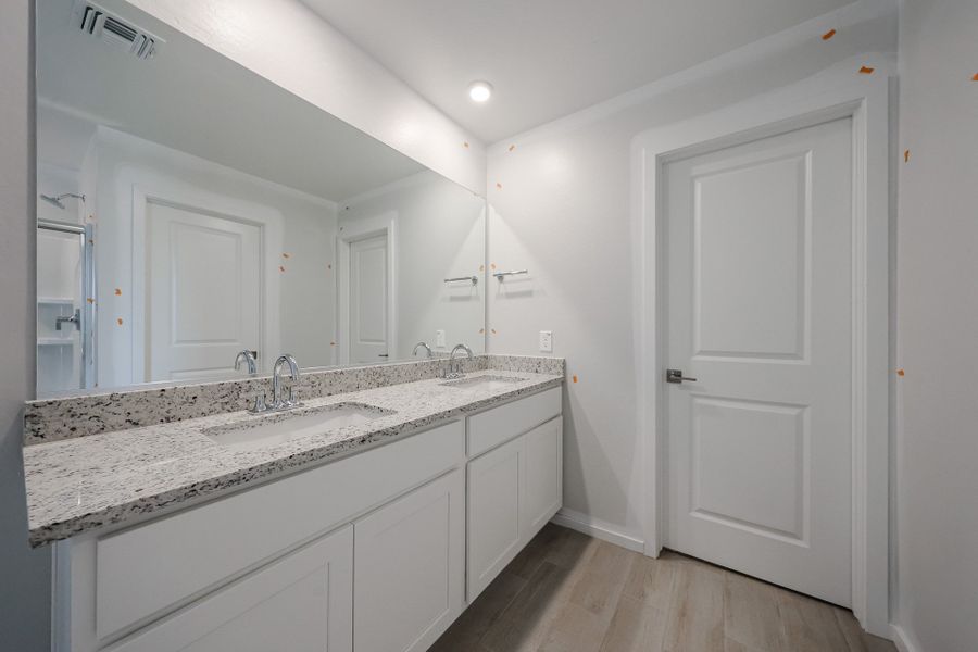 A bathroom with a marble countertop. A bathroom with a marble countertop.