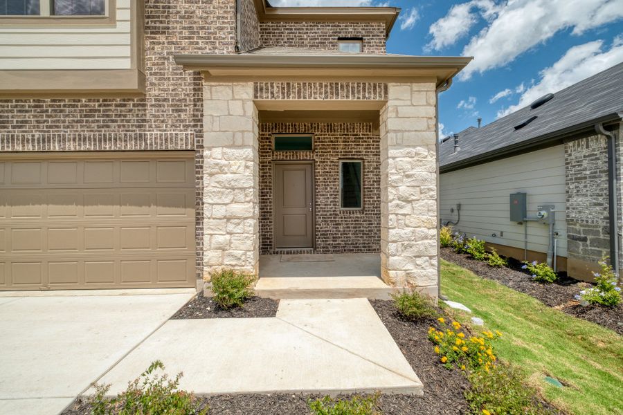 Exterior details and patio area of a home in Trinity Ranch, Elgin (Image 3).
