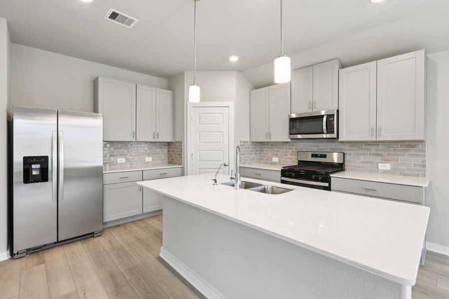 Furnished interior view inside a new home in Massey Oaks - Premier Series, Pearland (Image 9). Furnished interior view inside a new home in Massey Oaks - Premier Series, Pearland (Image 9).