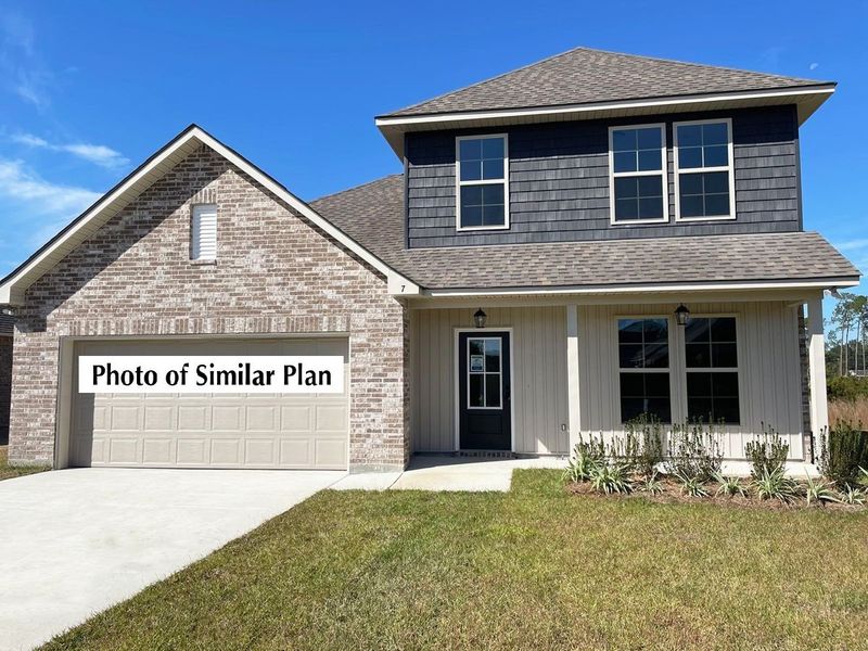 Front exterior of a new home in The Bluffs at Lafayette, Freeport, FL, highlighting curb appeal (Image 2). Front exterior of a new home in The Bluffs at Lafayette, Freeport, FL, highlighting curb appeal (Image 2).