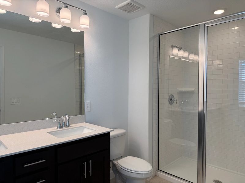 Primary bathroom with double sinks and a walk-in shower - under construction
