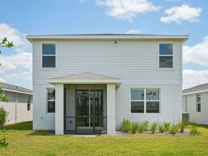 Exterior details and patio area of a home in Crescent Lakes - Premier Series, Punta Gorda (Image 3).