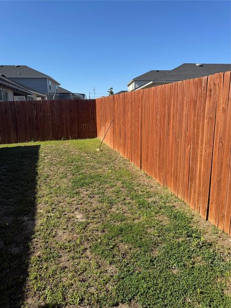 View of fenced backyard