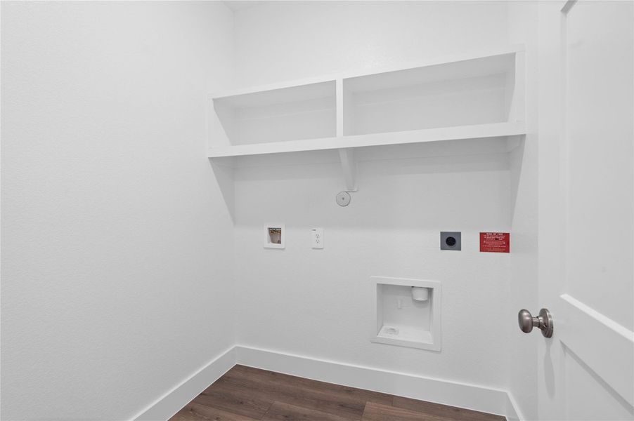 Maximize organization and efficiency in this dedicated laundry room, a clean and bright space designed to handle all your home's needs.