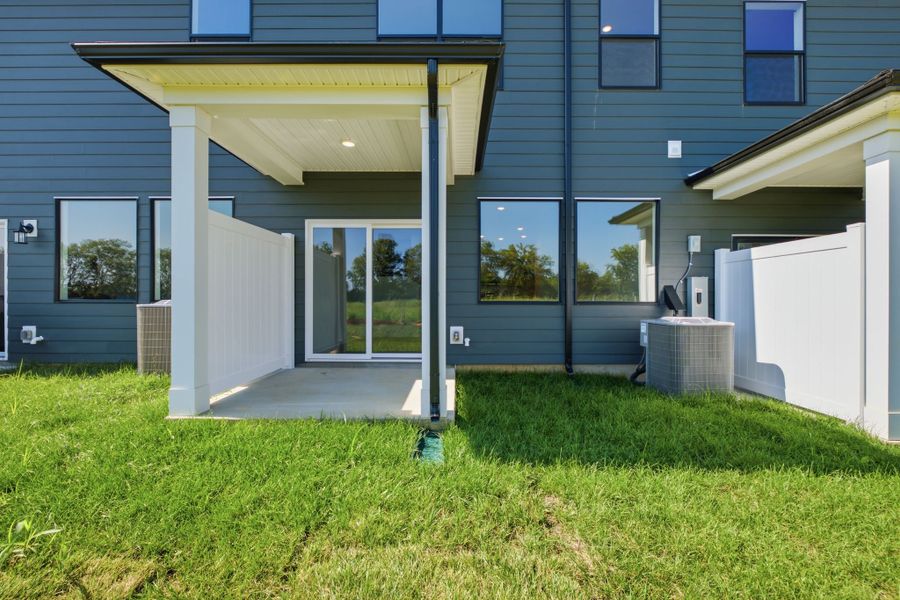 Exterior details and patio area of a home in Nexus Townhomes, Gallatin (Image 3).