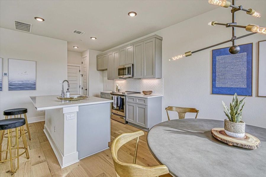 Furnished interior view inside a new home in Townhomes at Gattis, Round Rock (Image 6). Furnished interior view inside a new home in Townhomes at Gattis, Round Rock (Image 6).