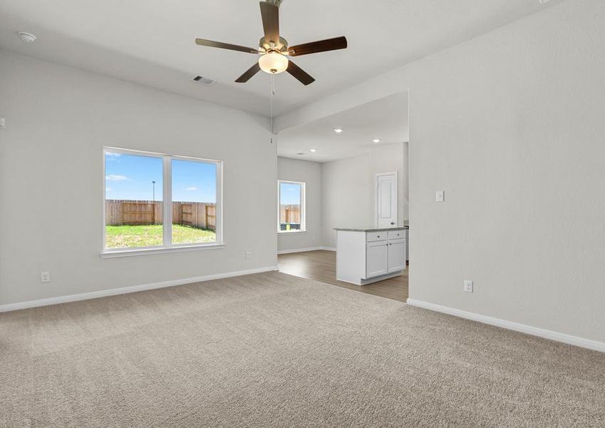 A spacious family room and adjoining kitchen