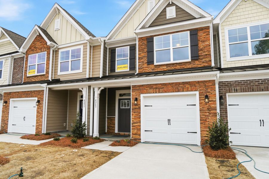 Front exterior of a new home in Harrisburg Village Townhomes, Harrisburg, NC, highlighting curb appeal (Image 23).