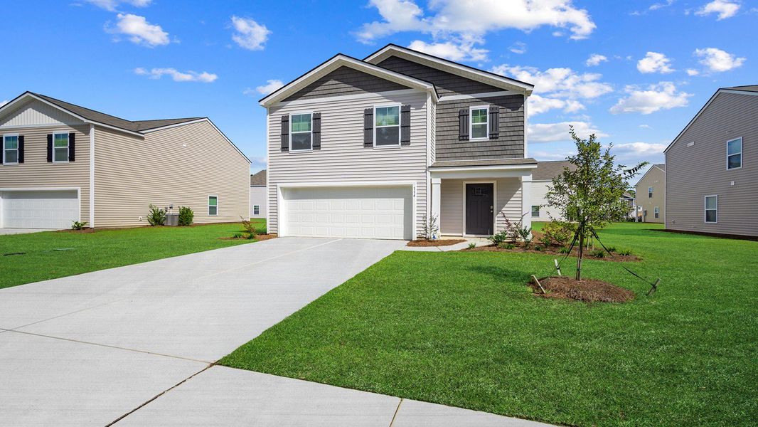 Front exterior of a new home in Cobblestone Village, Savannah, GA, highlighting curb appeal (Image 2).