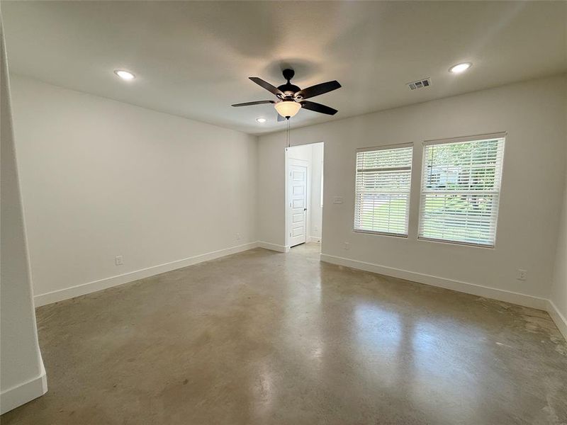 Unfurnished room with concrete floors, recessed lighting, and a ceiling fan