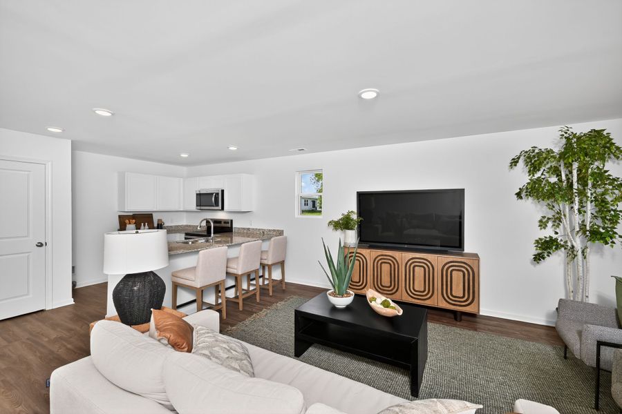 A living room with a tv and couches.