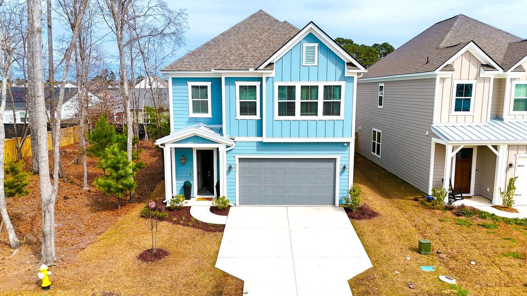 Front exterior of a new home in Park's Edge at Carolina Bay, Charleston, SC, highlighting curb appeal (Image 27). Front exterior of a new home in Park's Edge at Carolina Bay, Charleston, SC, highlighting curb appeal (Image 27).