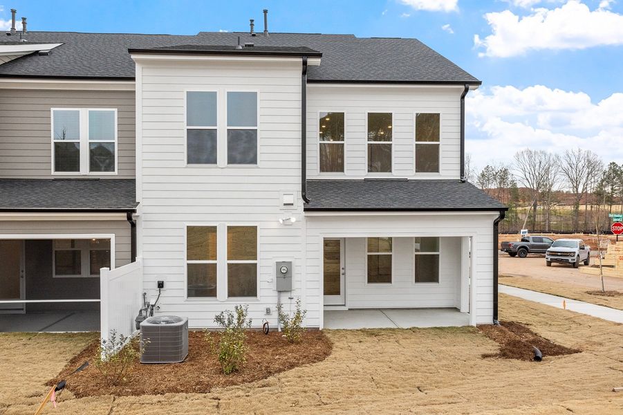 Exterior details and patio area of a home in Ovation at Sweetbrier, Durham (Image 19).