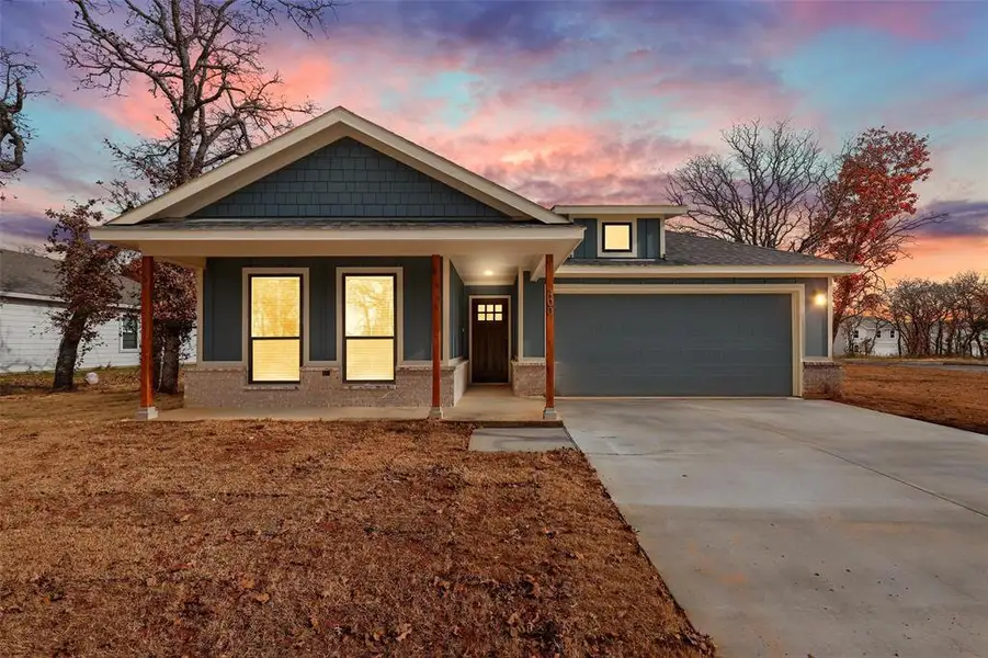 Front exterior of a new home in , Tolar, TX, highlighting curb appeal (Image 2). Front exterior of a new home in , Tolar, TX, highlighting curb appeal (Image 2).