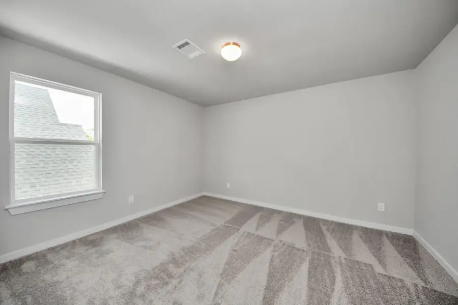 Secondary bedroom features plush carpeting, large windows that let in plenty of natural light, bright paint, and spacious closets. Secondary bedroom features plush carpeting, large windows that let in plenty of natural light, bright paint, and spacious closets.