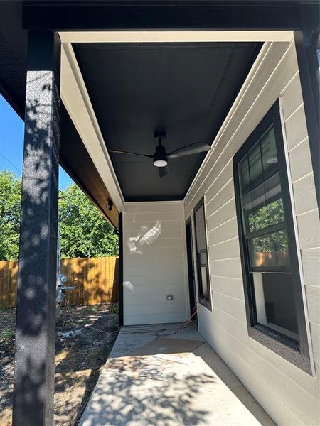 View of patio featuring ceiling fan