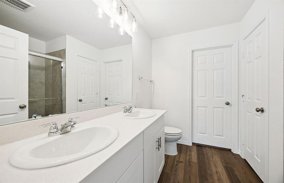 Owner's private bath with double vanity