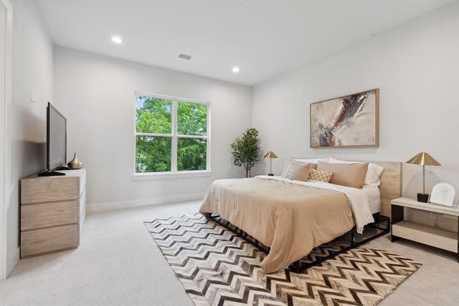 The oversized primary bedroom, adorned with large windows, illuminates the space effortlessly, making artificial lighting almost redundant.