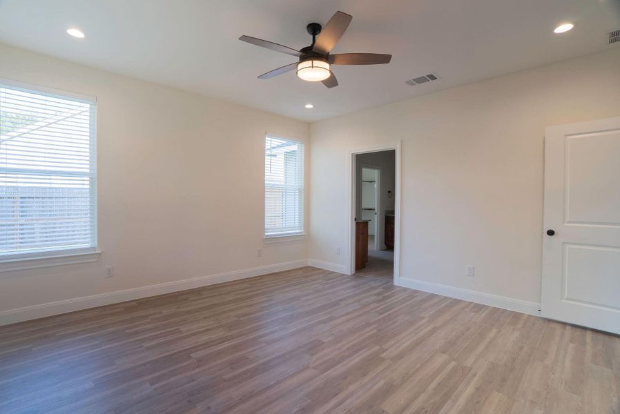 Unfurnished bedroom with light wood-type flooring, recessed lighting, and ceiling fan Unfurnished bedroom with light wood-type flooring, recessed lighting, and ceiling fan