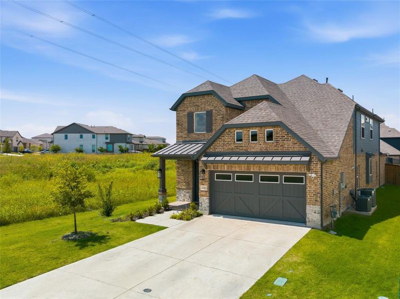 Front exterior of a new home in The Villages of Hurricane Creek, Anna, TX, highlighting curb appeal (Image 23).