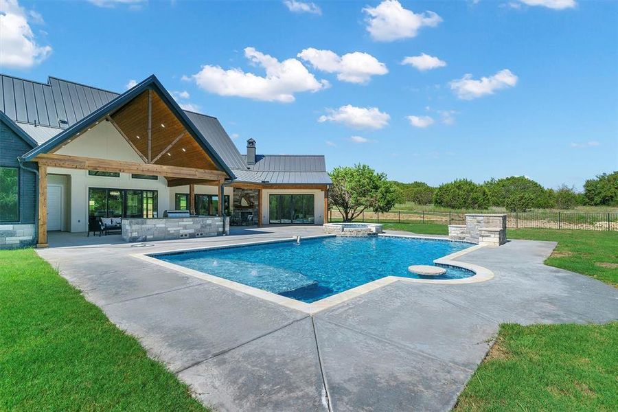 View of pool with a yard and a patio