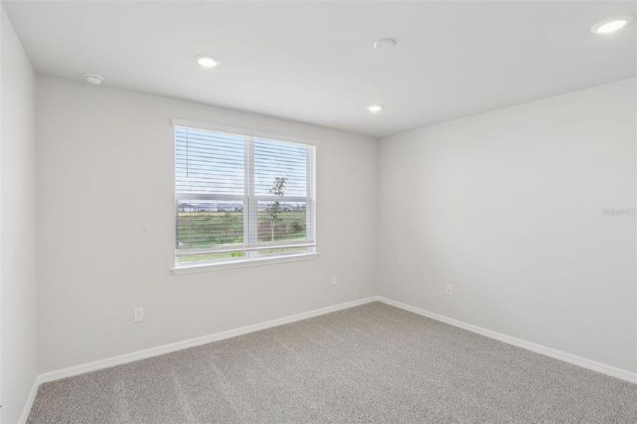 Spacious, unfurnished interior of a new home in Crescent Lakes - Premier Series, Punta Gorda (Image 25).