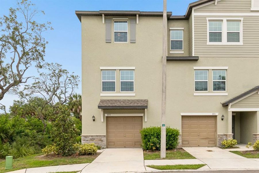 Front exterior of a new home in , Tampa, FL, highlighting curb appeal (Image 1). Front exterior of a new home in , Tampa, FL, highlighting curb appeal (Image 1).