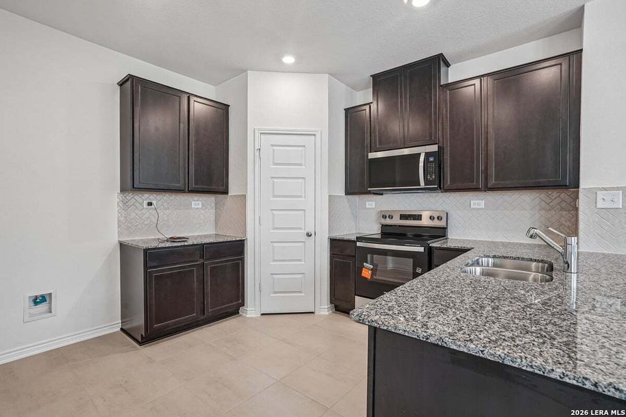 Furnished interior view inside a new home in Medina Crossing, Von Ormy (Image 5).