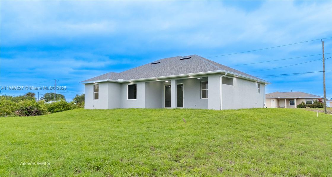 Front exterior of a new home in , Lehigh Acres, FL, highlighting curb appeal (Image 18).