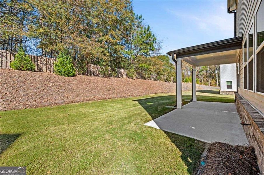 Exterior details and patio area of a home in The Paddocks at Doc Hughes, Buford (Image 29). Exterior details and patio area of a home in The Paddocks at Doc Hughes, Buford (Image 29).