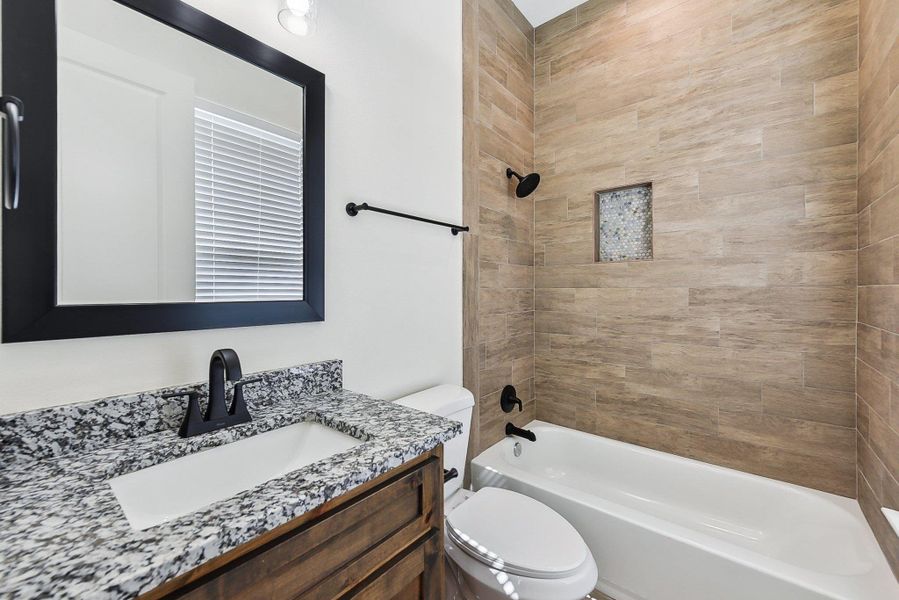 En-suite Bedroom/ Bath with vanity, toilet, and shower / washtub combination En-suite Bedroom/ Bath with vanity, toilet, and shower / washtub combination