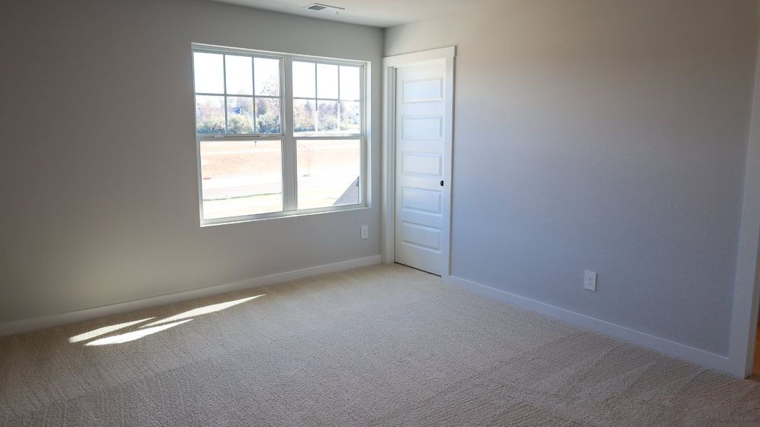 Representative unfurnished interior of a home built from the TISDALE by D.R. Horton in Harvest Point, Spring Hill (Image 58).