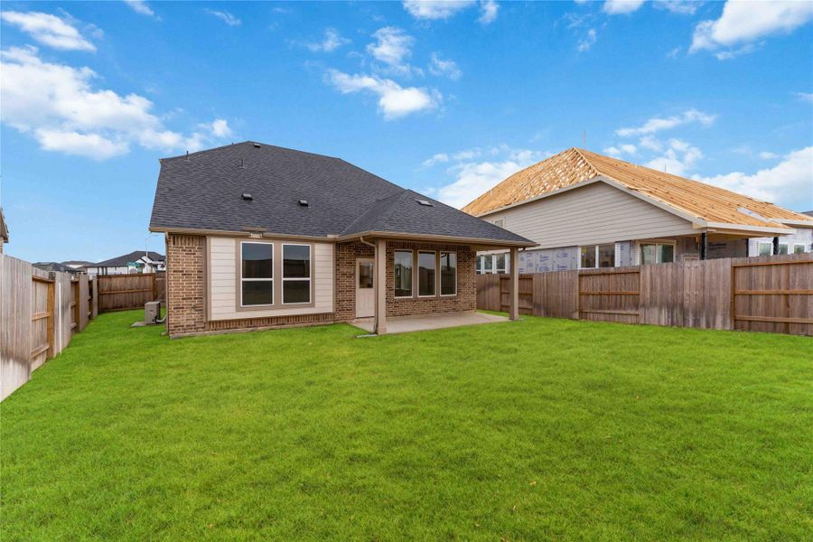 Exterior details and patio area of a home in Sunterra, Katy (Image 3).