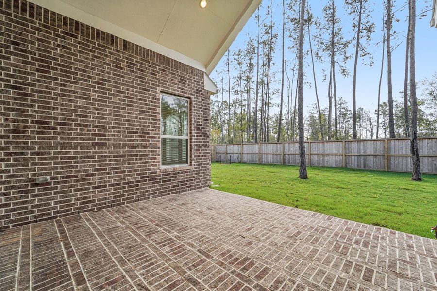 Exterior details and patio area of a home in Evergreen, Conroe (Image 3). Exterior details and patio area of a home in Evergreen, Conroe (Image 3).