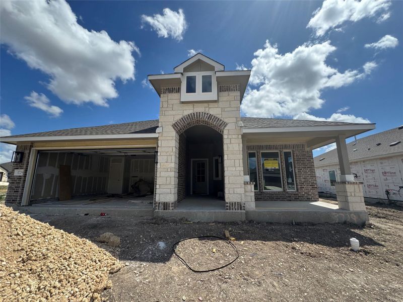 Front exterior of a new home in Village at Three Oaks, Seguin, TX, highlighting curb appeal (Image 14).