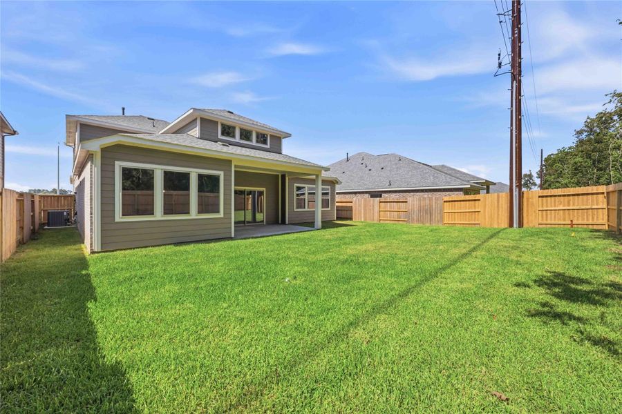 Exterior details and patio area of a home in Sundance Cove, Crosby (Image 19).