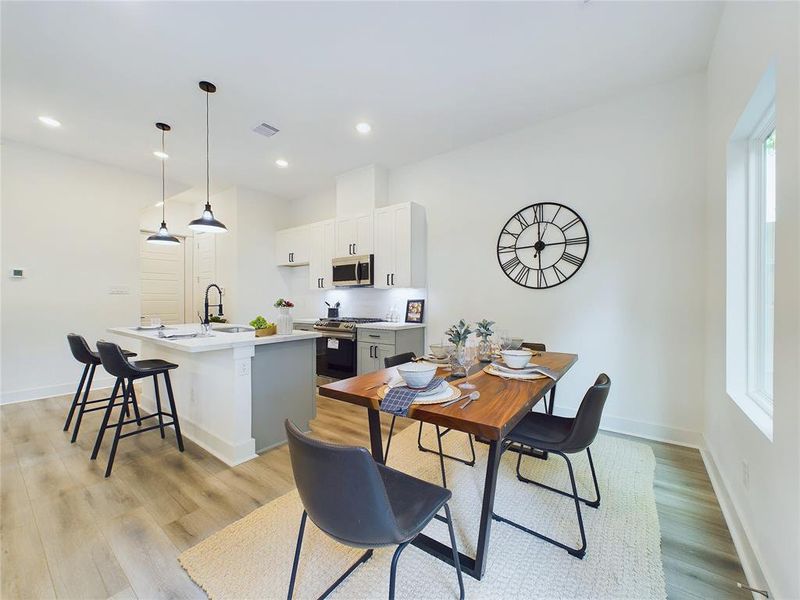 Gorgeous dining area with plenty of room for family/friends gatherings! Ceiling fans are NOT INCLUDED!