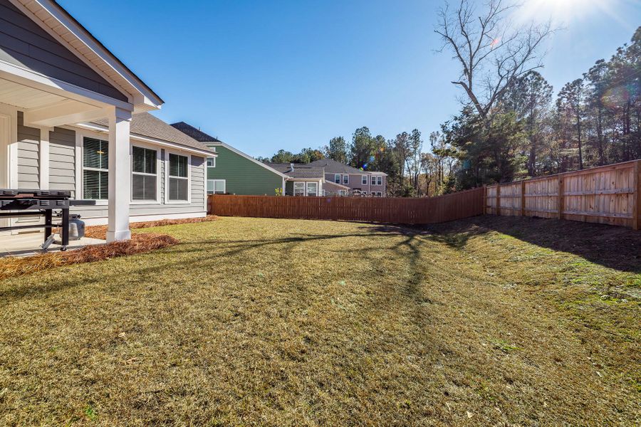 Exterior details and patio area of a home in High Point at Foxbank, Moncks Corner (Image 21).
