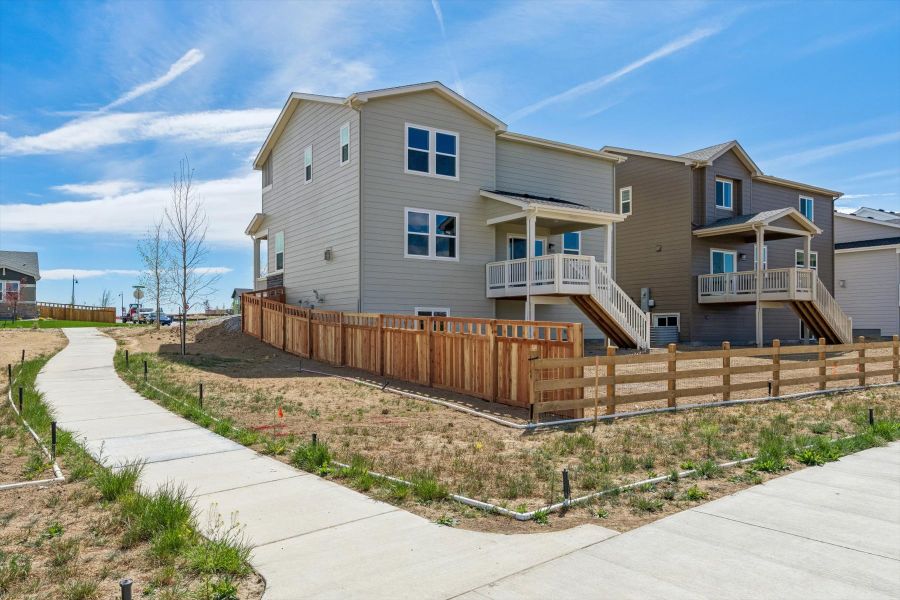 A house with a fence around it. A house with a fence around it.