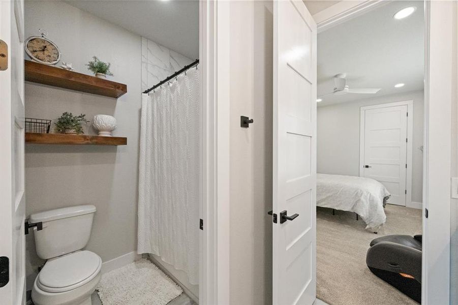 Private toilet and shower area of connected bathroom